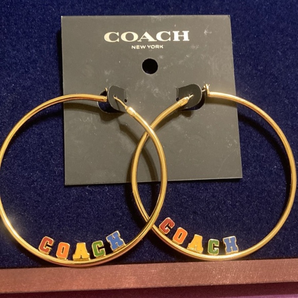 NWT Gold tone large hoop lever back earrings w/multicolored block letter logo